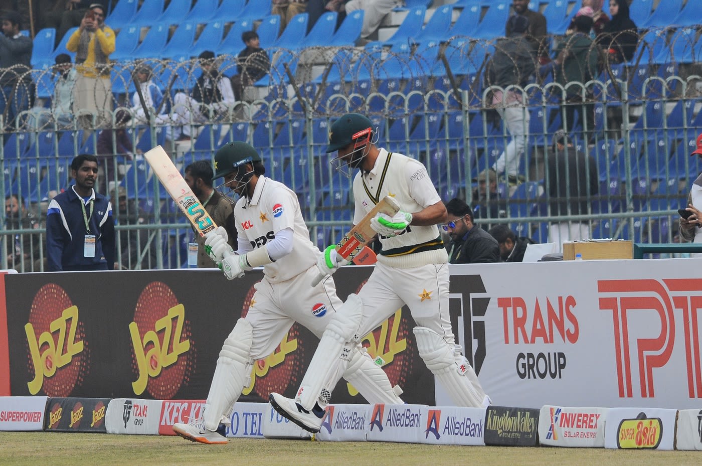 Debutant Muhammad Hurraira strides out for his first Test innings alongside captain Shan Masood
