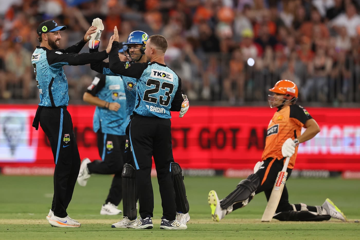 D'Arcy Short celebrates with his team-mates after a wicket