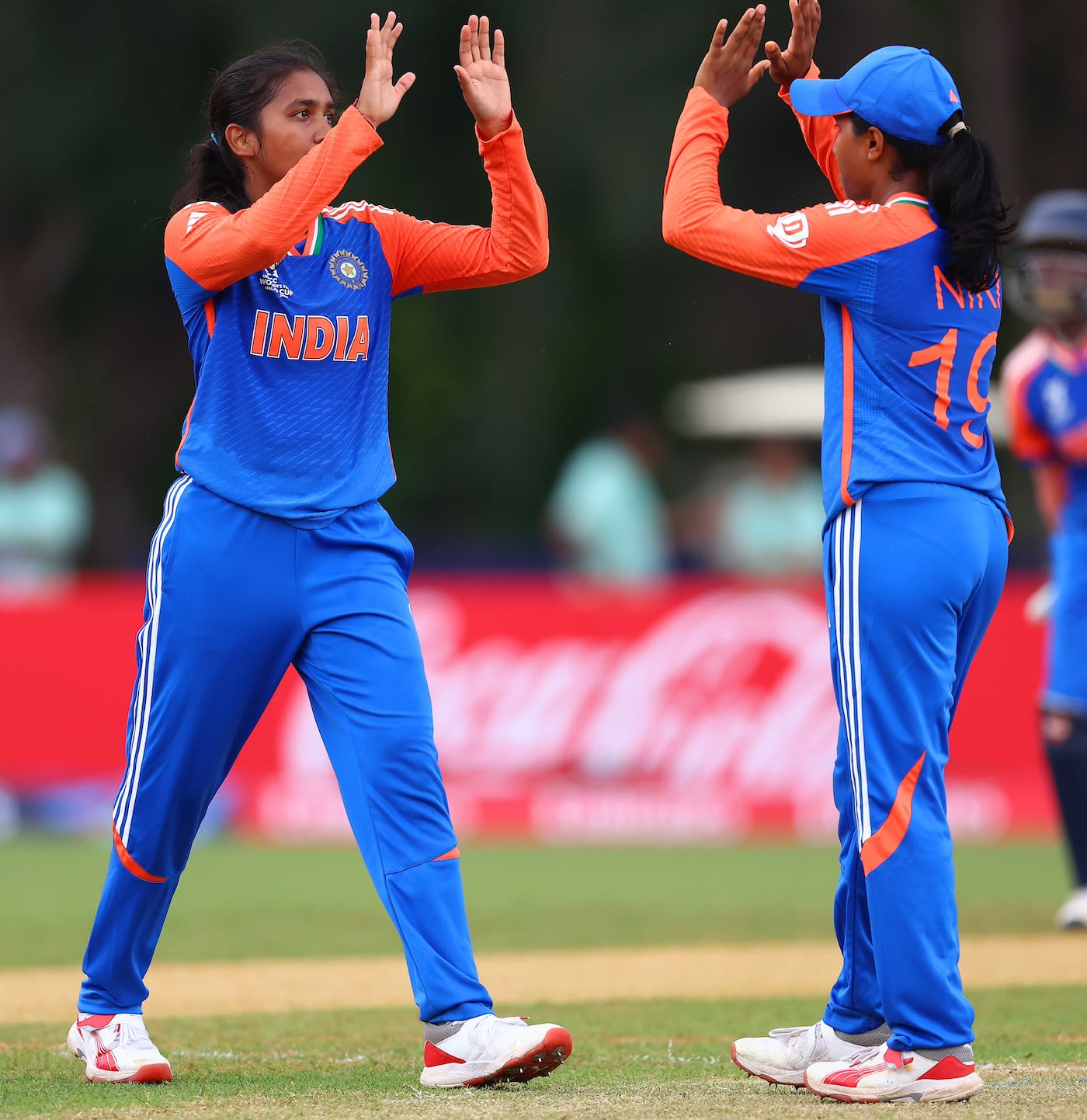 Parunika Sisodia celebrates a wicket with her captain, Niki Prasad