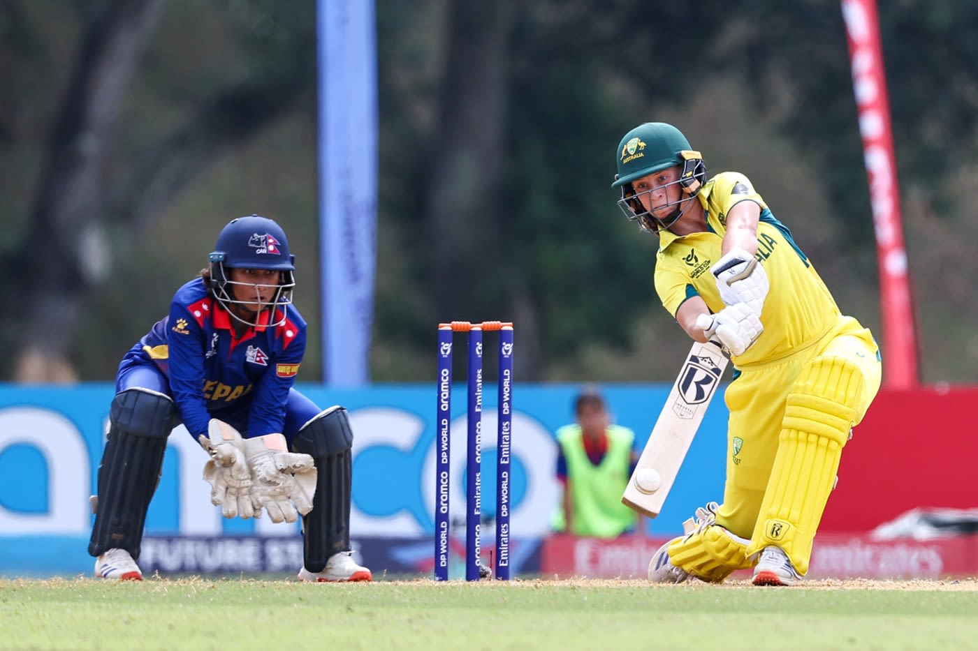 Caoimhe Bray hits over off in her 34-ball 45 as Nepal wicketkeeper Alisha Yadav looks on