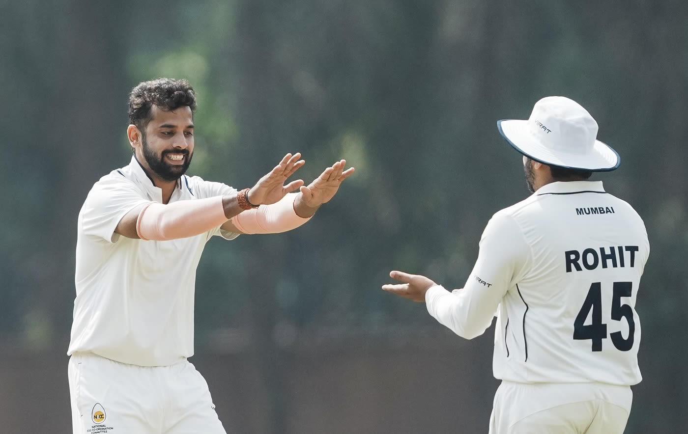 Mohit Avasthi and Rohit Sharma celebrate a wicket