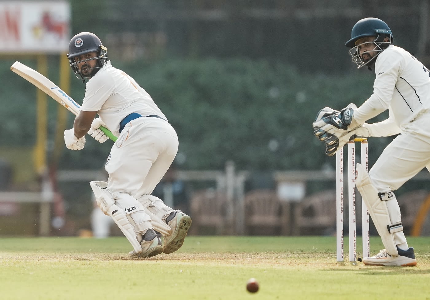 Shubham Khajuria glances one fine as Hardik Tamore looks on from behind the stumps