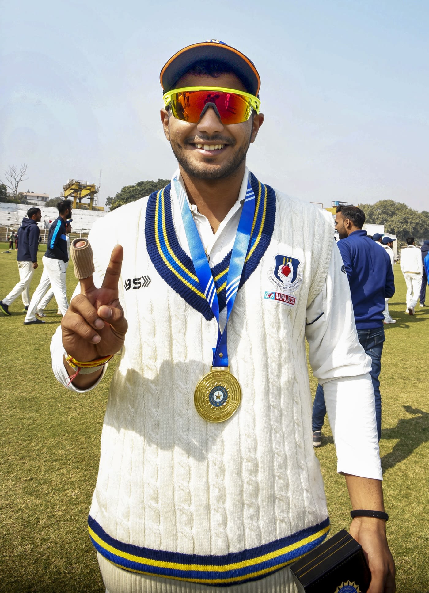 Aryan Juyal poses with the Player-of-the-Match medal