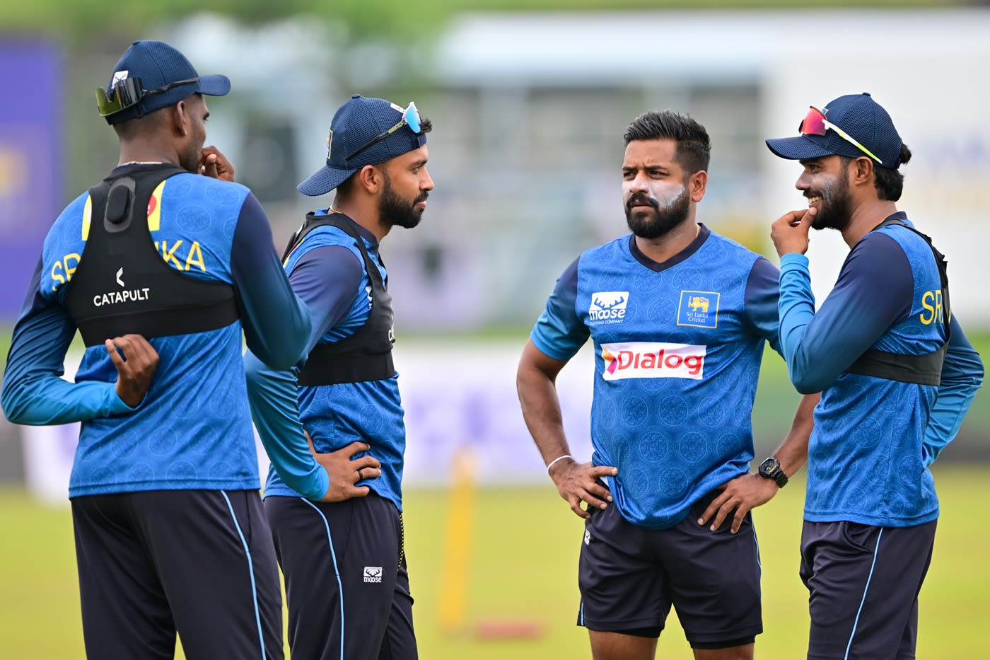 Sadeera Samarawickrama and Dhananjaya de Silva chat while Lahiru Udara looks on