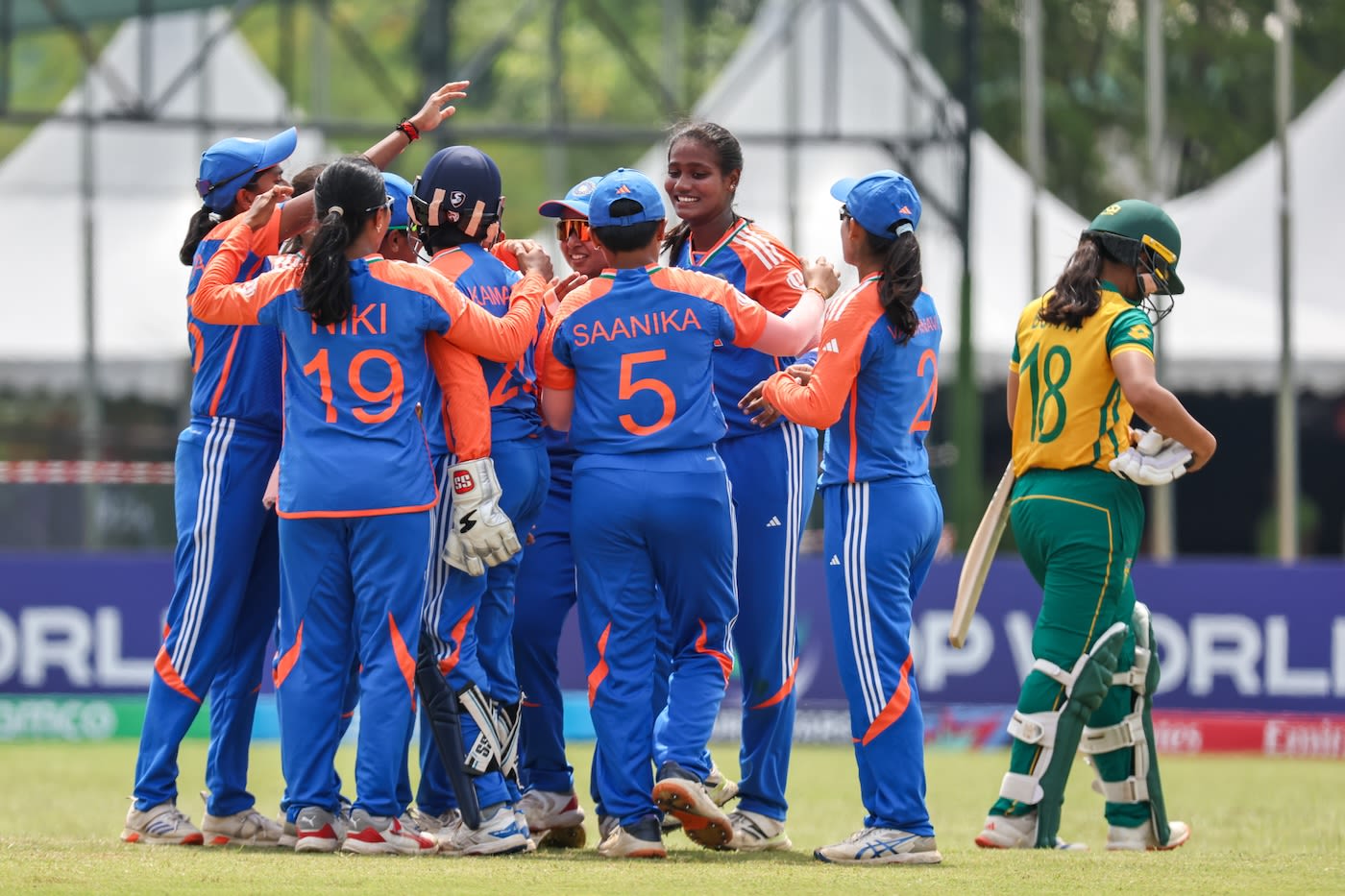The Indian team gets around Shabnam Shakil after the wicket of Jemma Botha