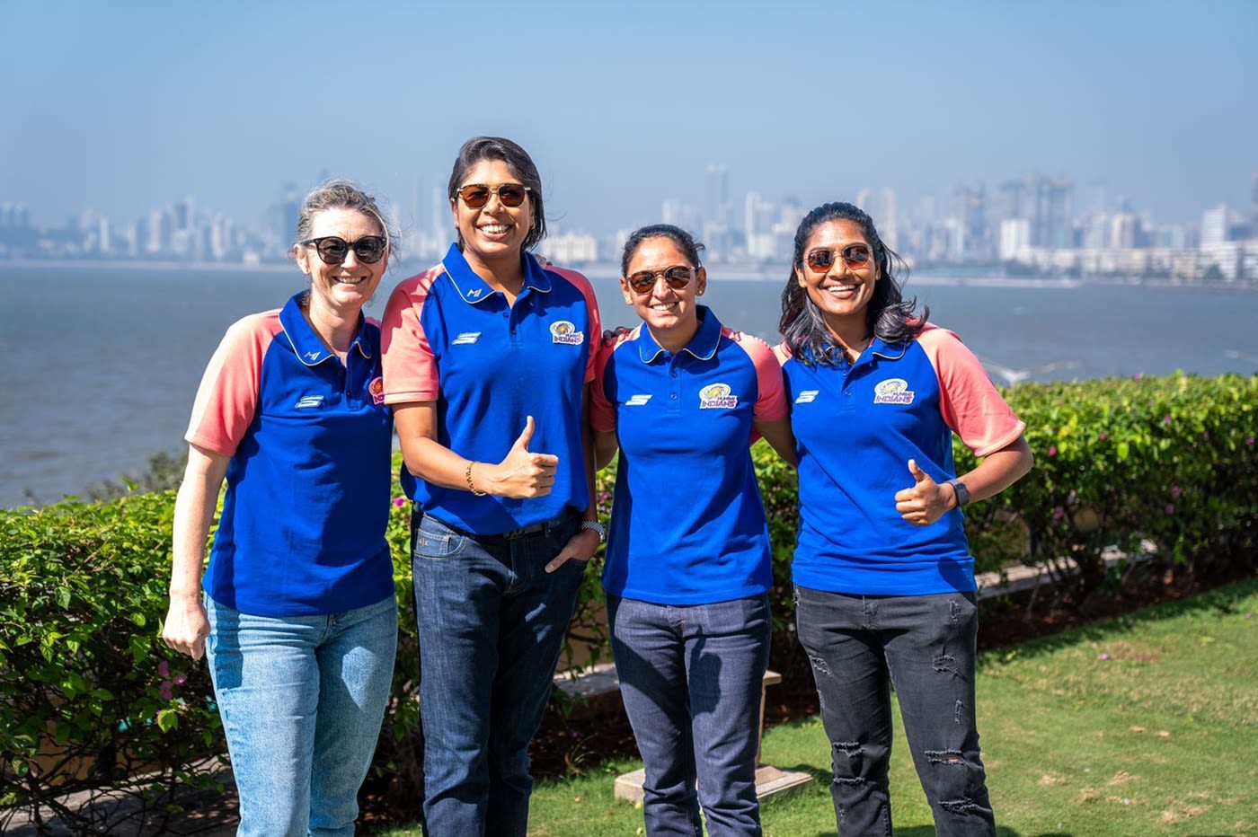 Charlotte Edwards, Jhulan Goswami, Harmanpreet Kaur and Sajeevan Sajana of Mumbai Indians pose with the Queen's Necklace in the background