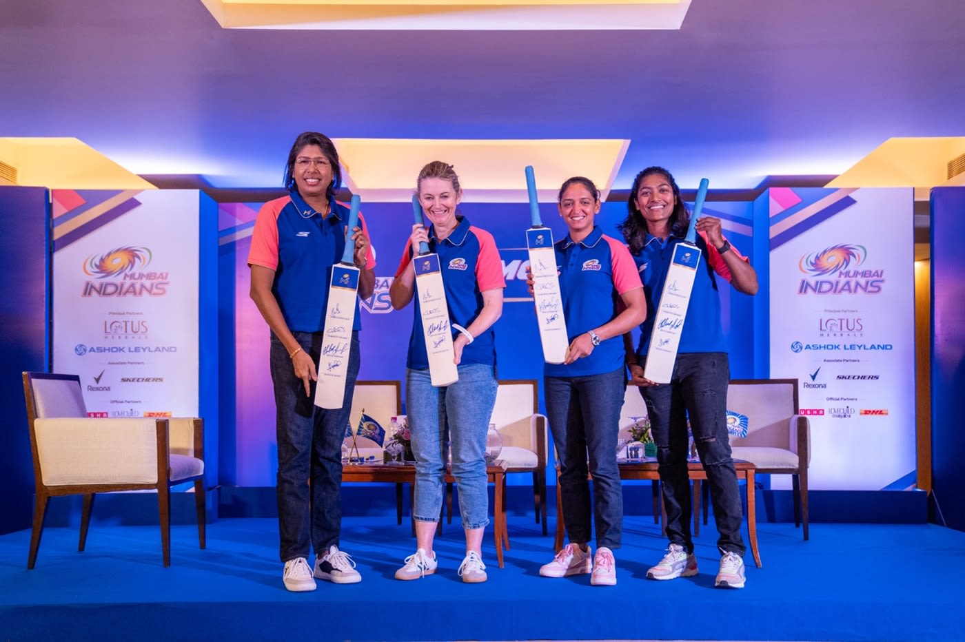 Mumbai Indians' Charlotte Edwards, Jhulan Goswami, Harmanpreet Kaur and Sajeevan Sajana with the signed souvenirs