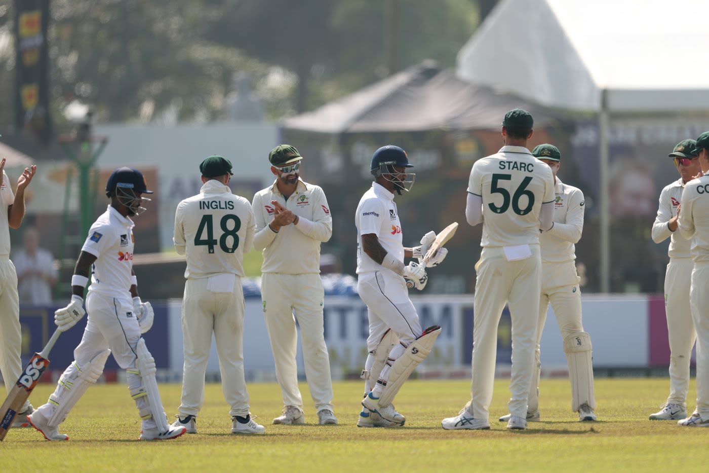 Australia's players form a guard of honour for Dimuth Karunaratne is his final Test