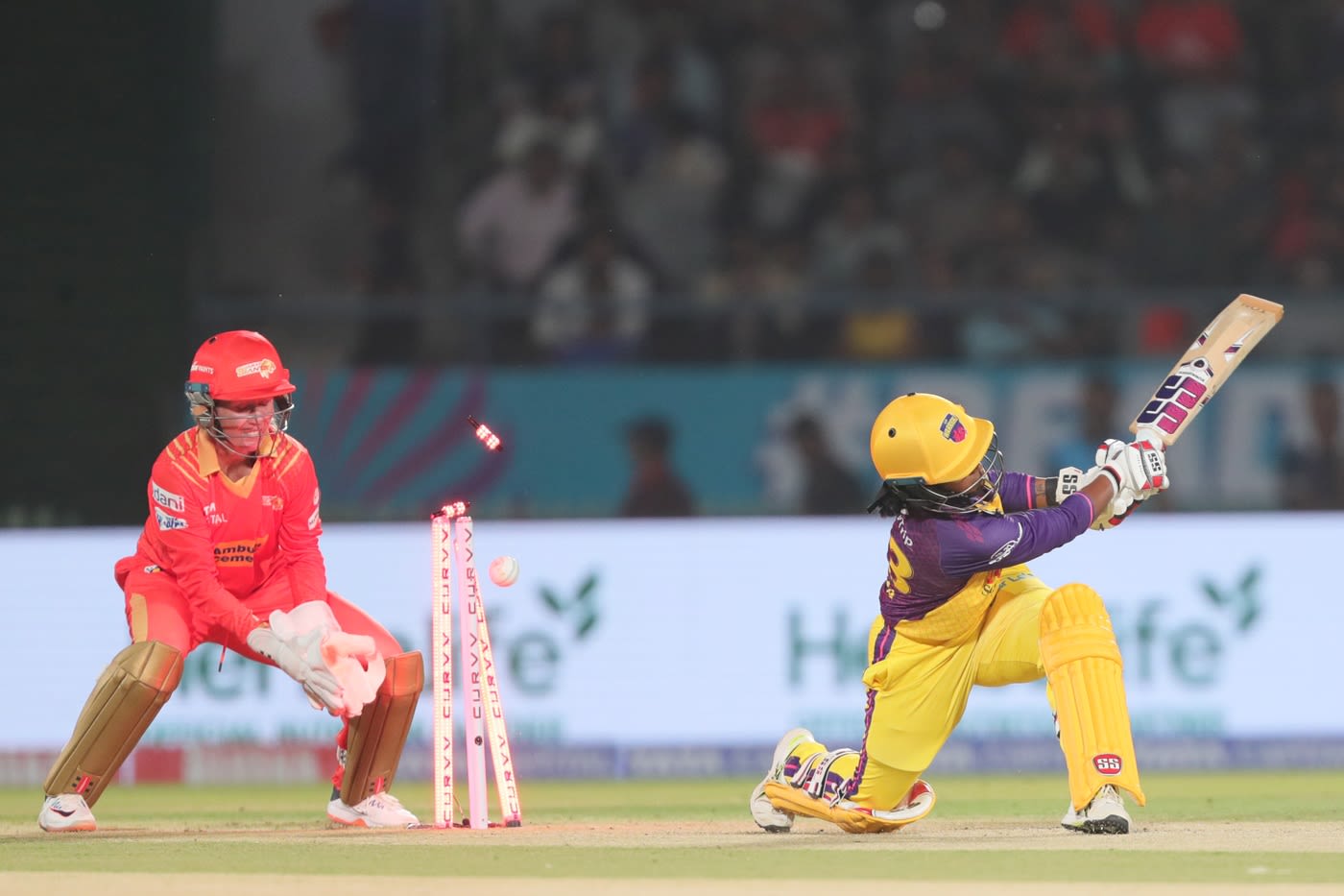 Vrinda Dinesh misses a sweep and is bowled