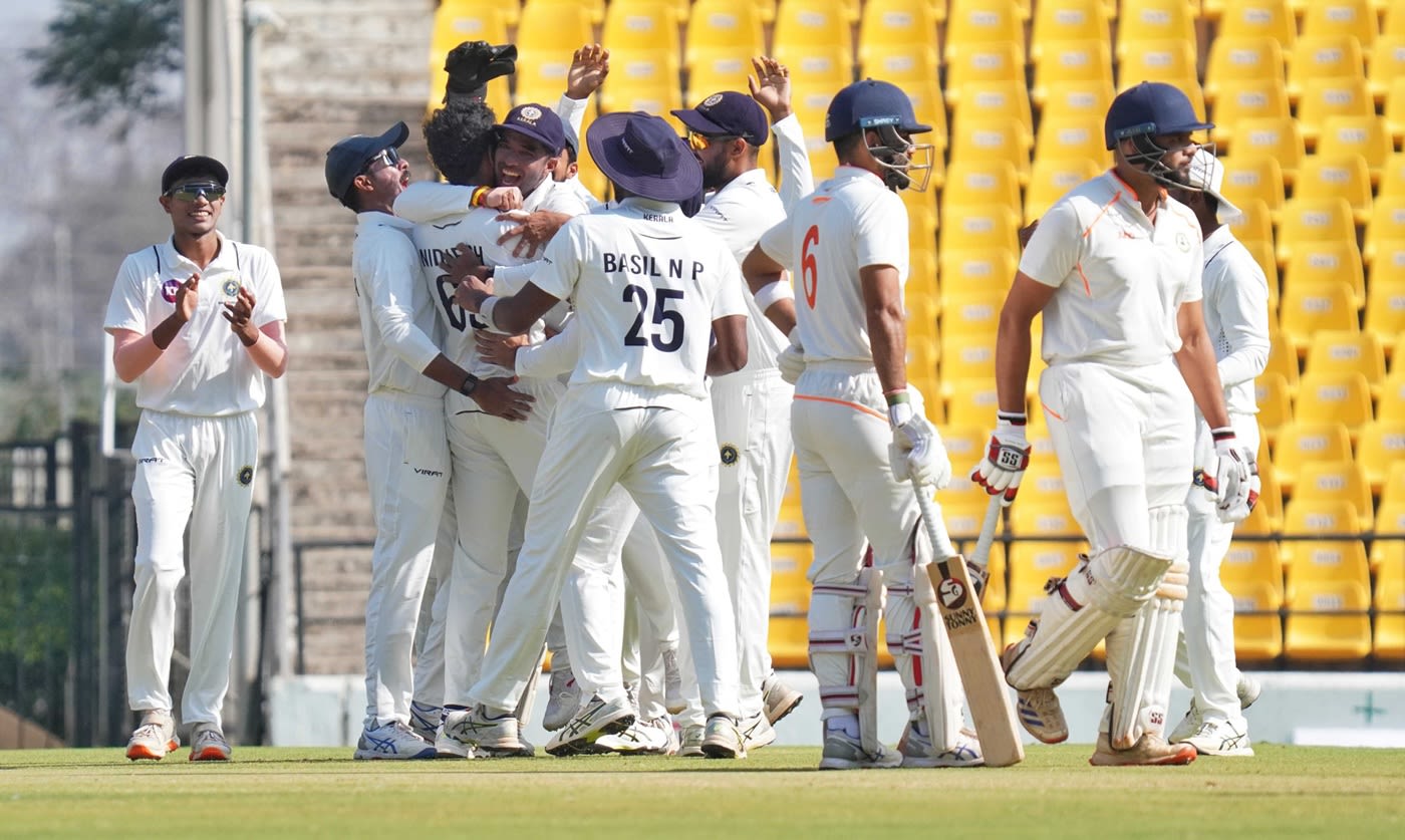 MD Nidheesh is mobbed by his Kerala team-mates after striking with the second ball of the Ranji Trophy final