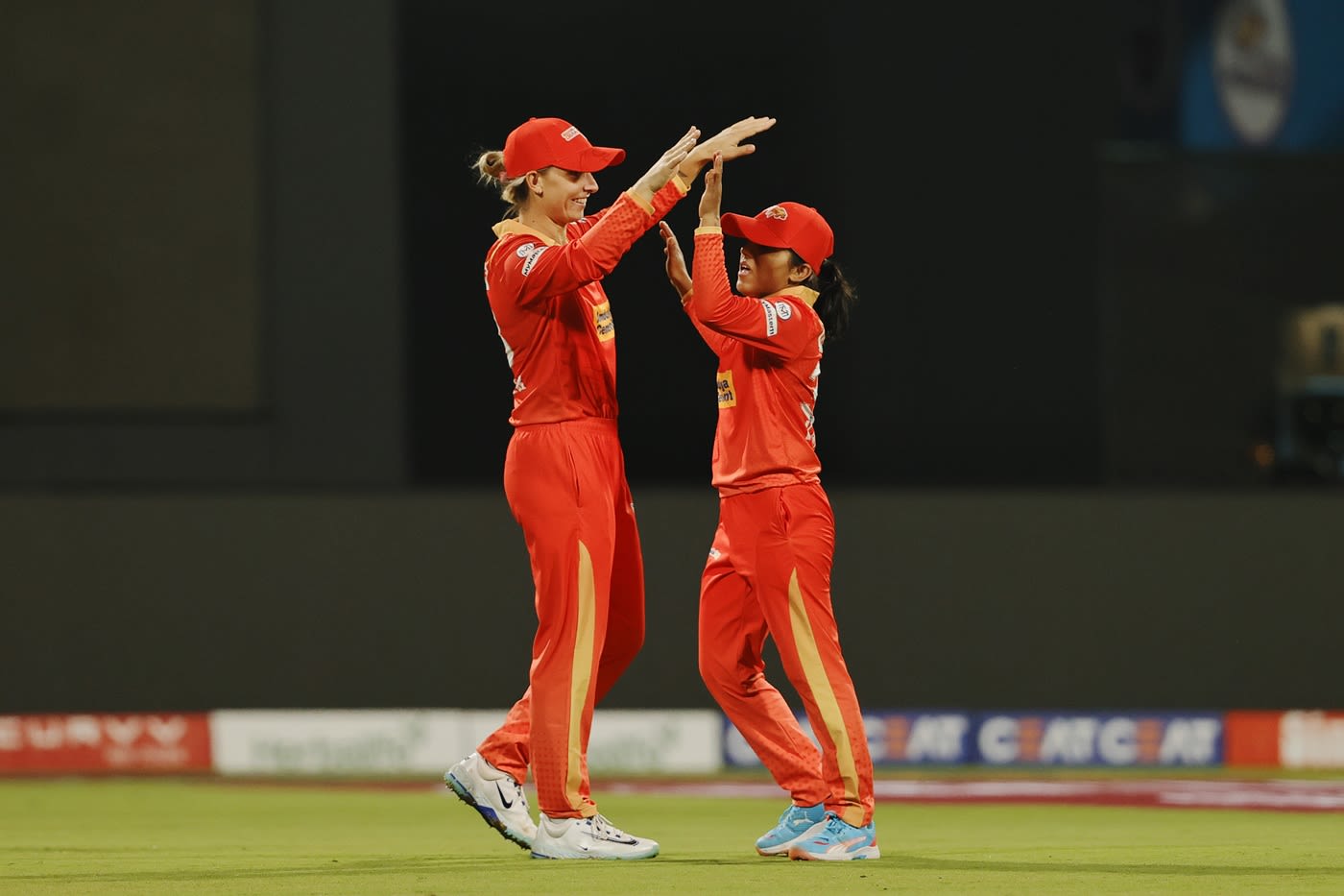 Tanuja Kanwar celebrates a wicket with Ash Gardner