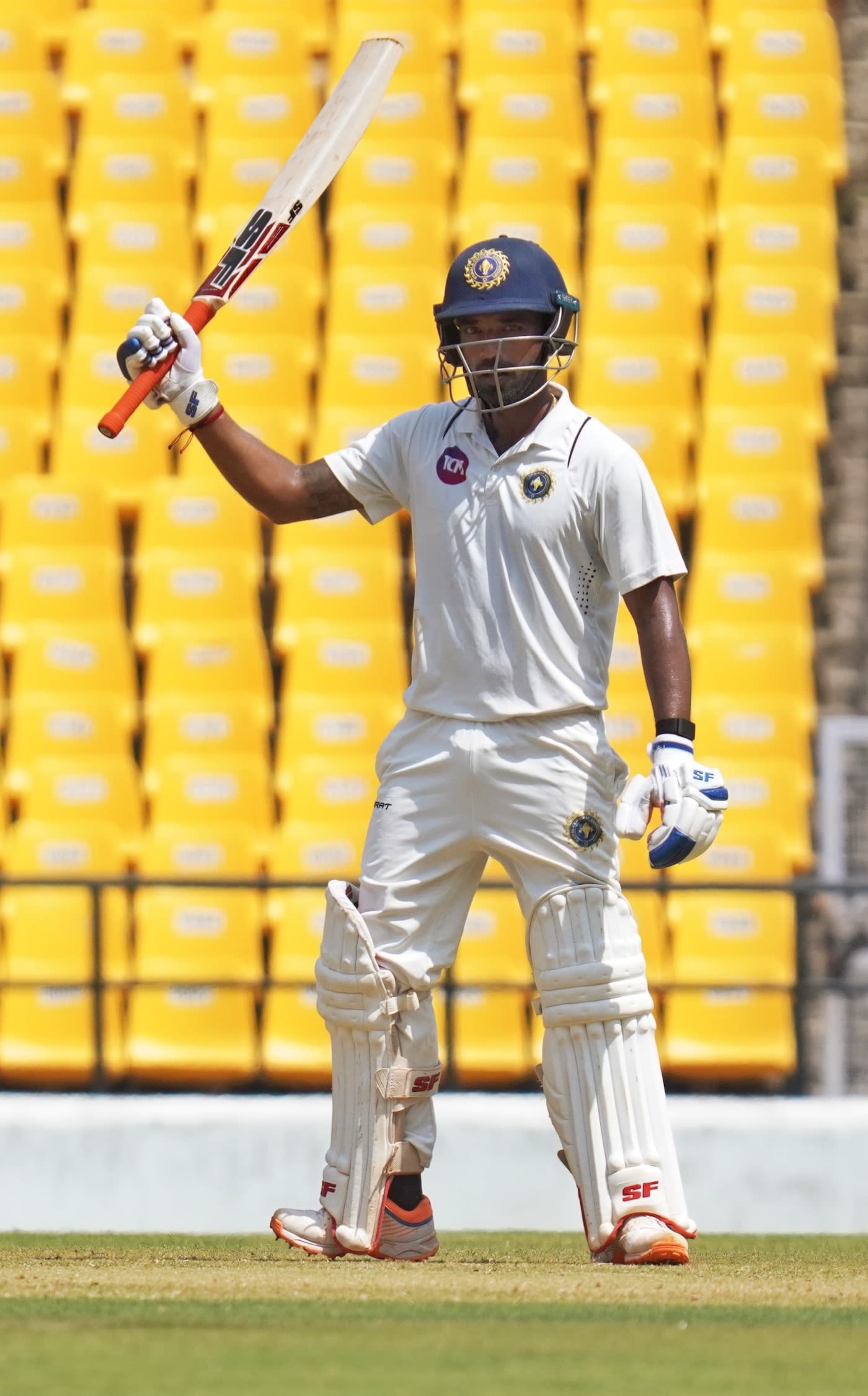Sachin Baby celebrates a half-century in his hundredth first-class match