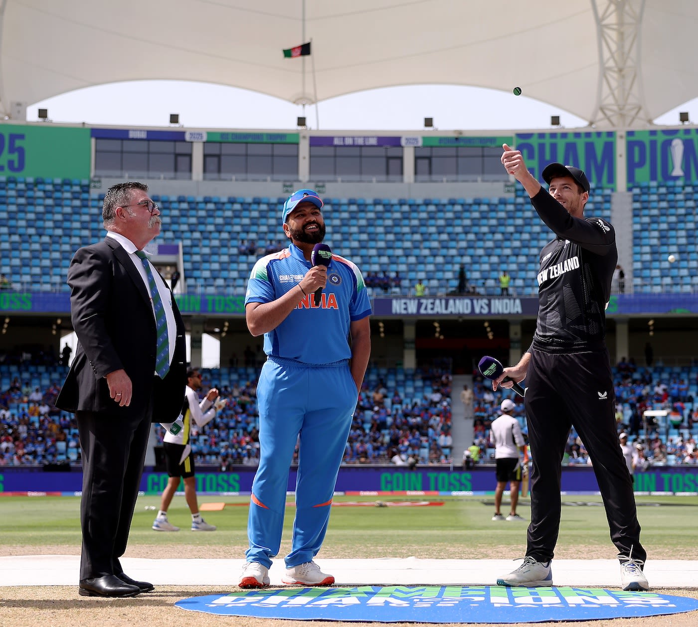 David Boon looks on as Mitchell Santner flips the coin; Rohit Sharma called wrong and was asked to bat