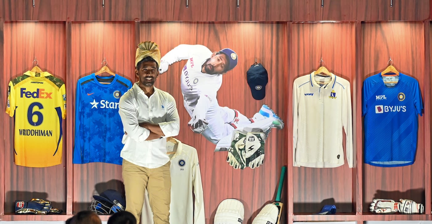 Wriddhiman Saha proudly poses in front of his jerseys