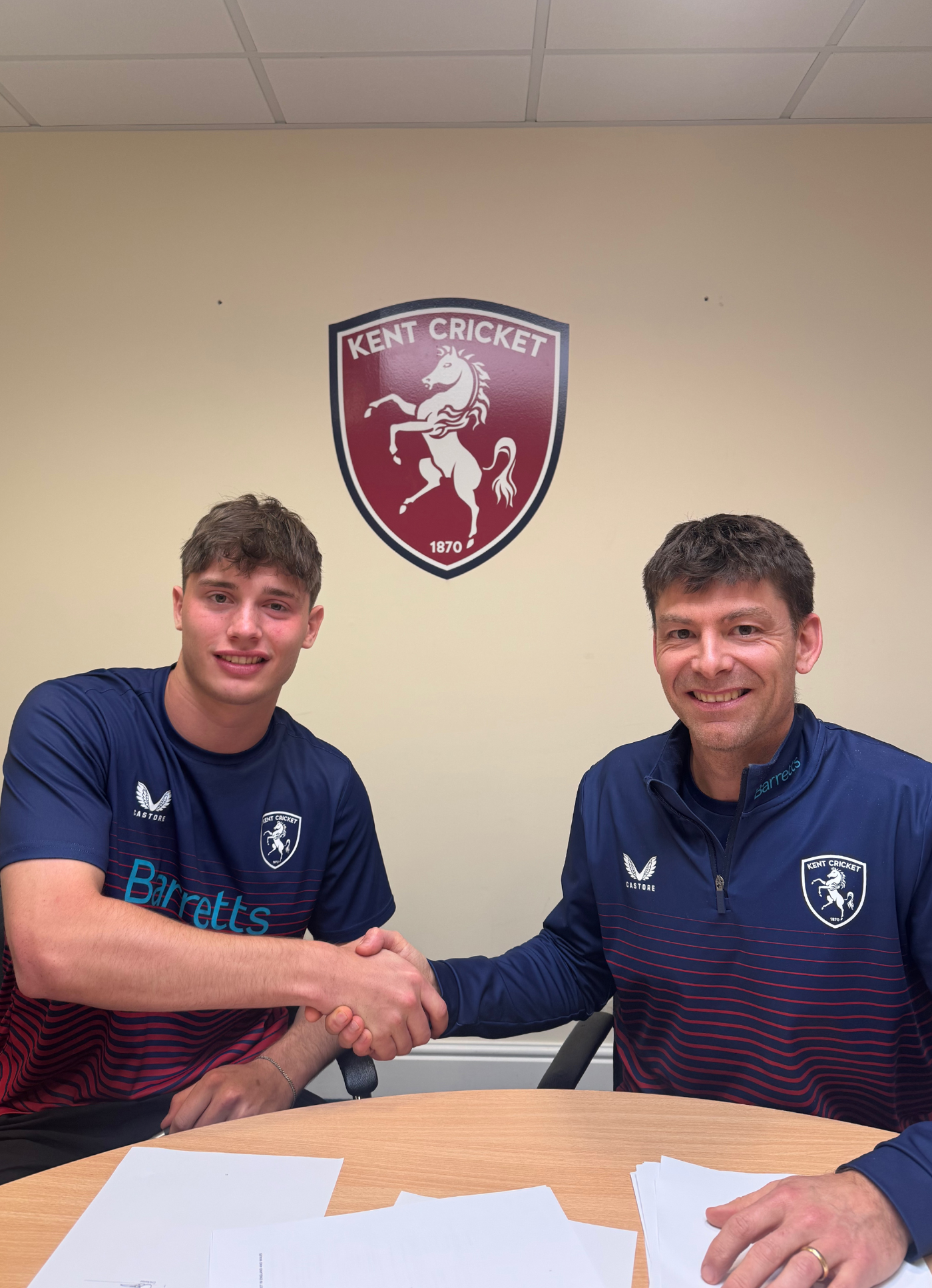Corey Flintoff shakes hands with Kent's director of cricket, Simon Cook, after signing a rookie deal