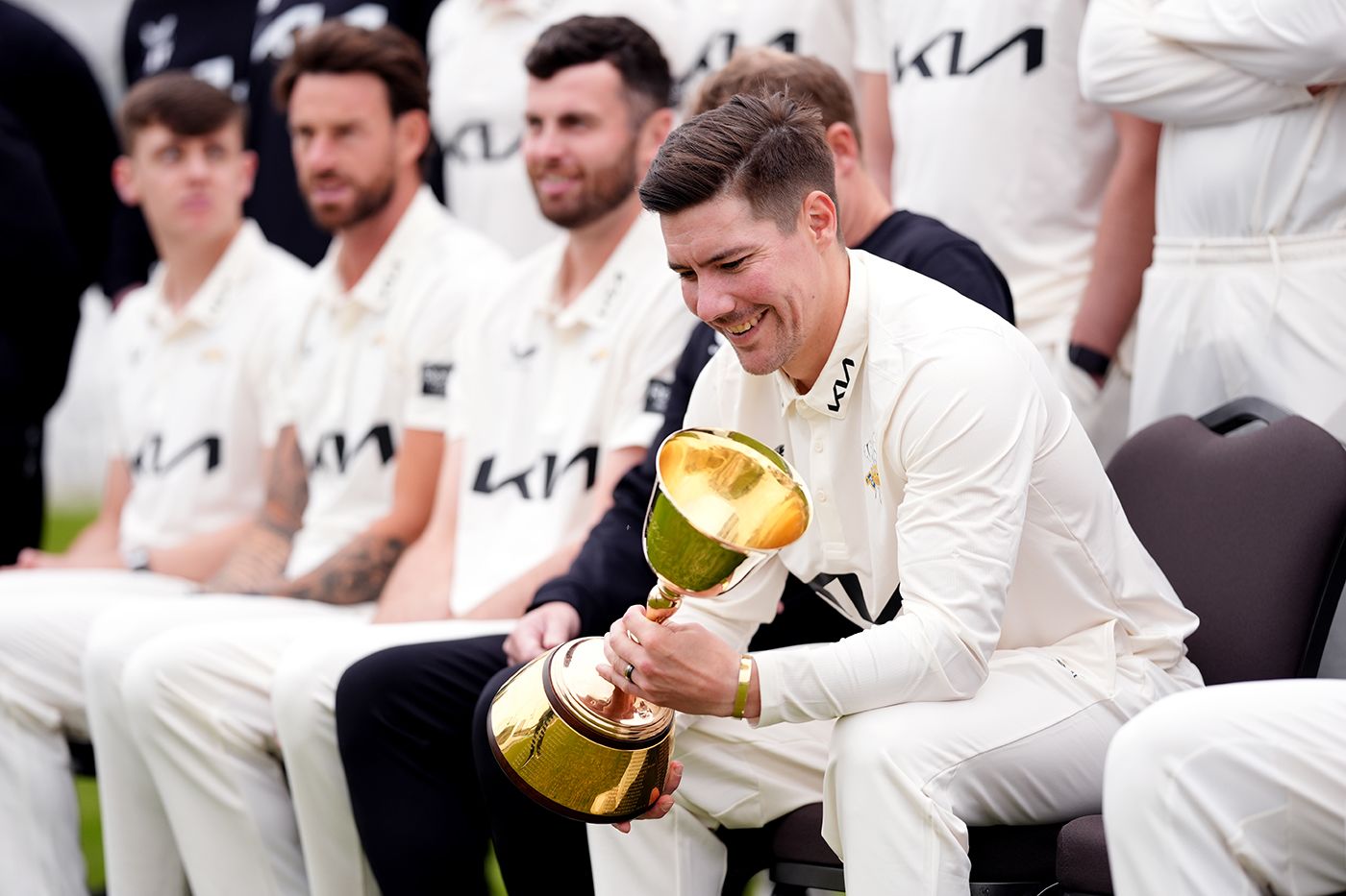 Rory Burns holds the County Championship trophy