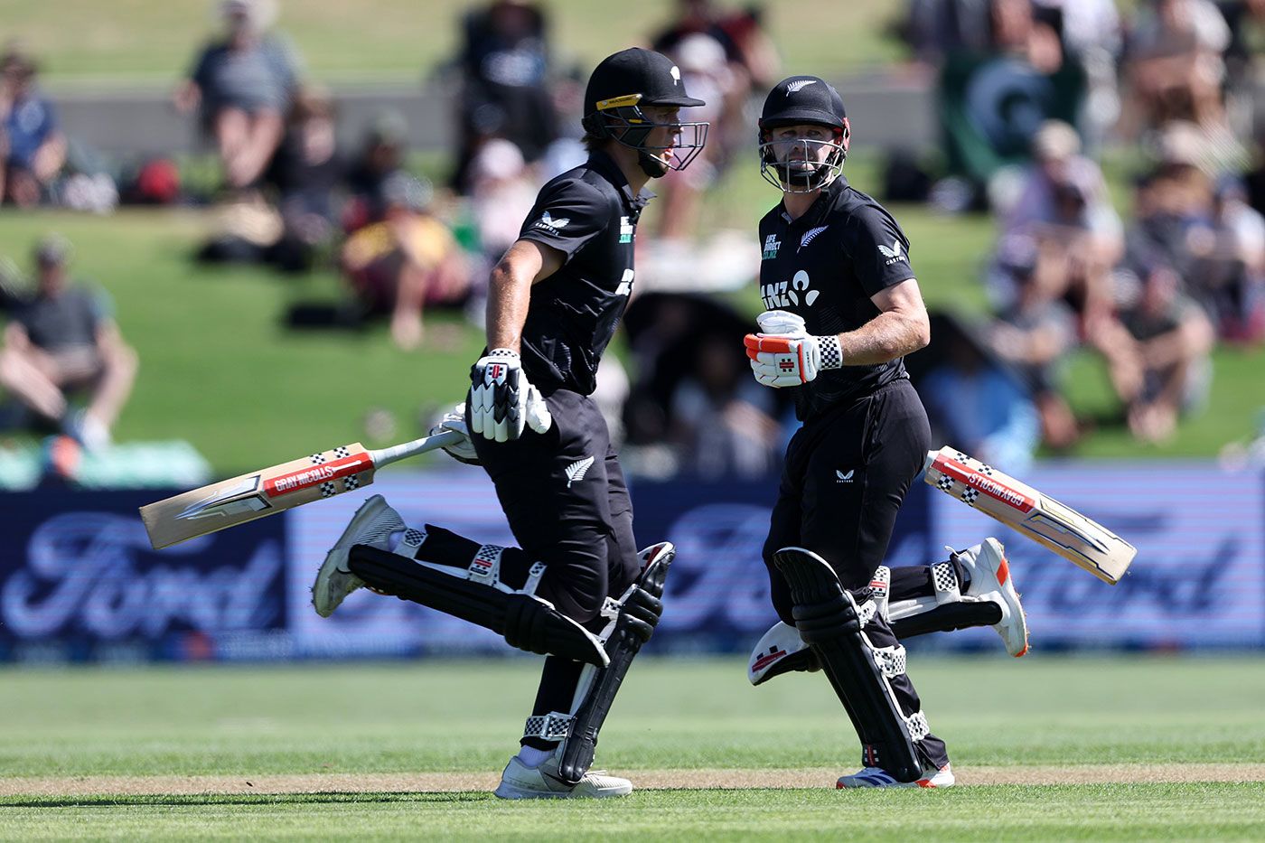 Rhys Mariu and Henry Nicholls run between the wickets
