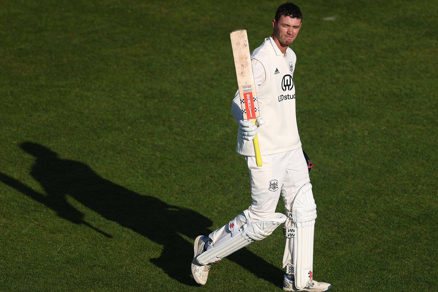 Ollie Price walks off after scoring 101