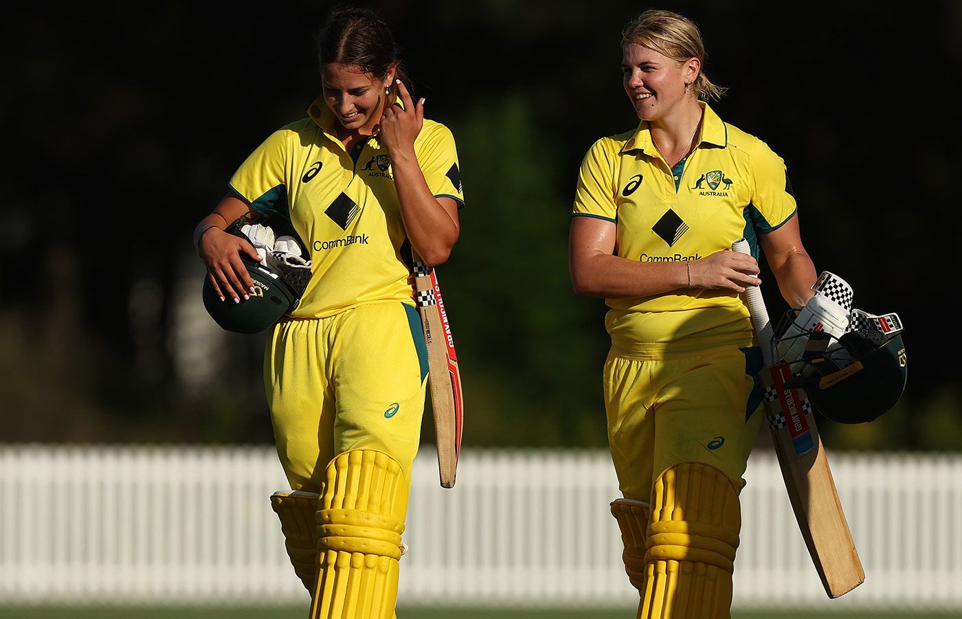 Tess Flintoff and Georgia Voll walk off after victory