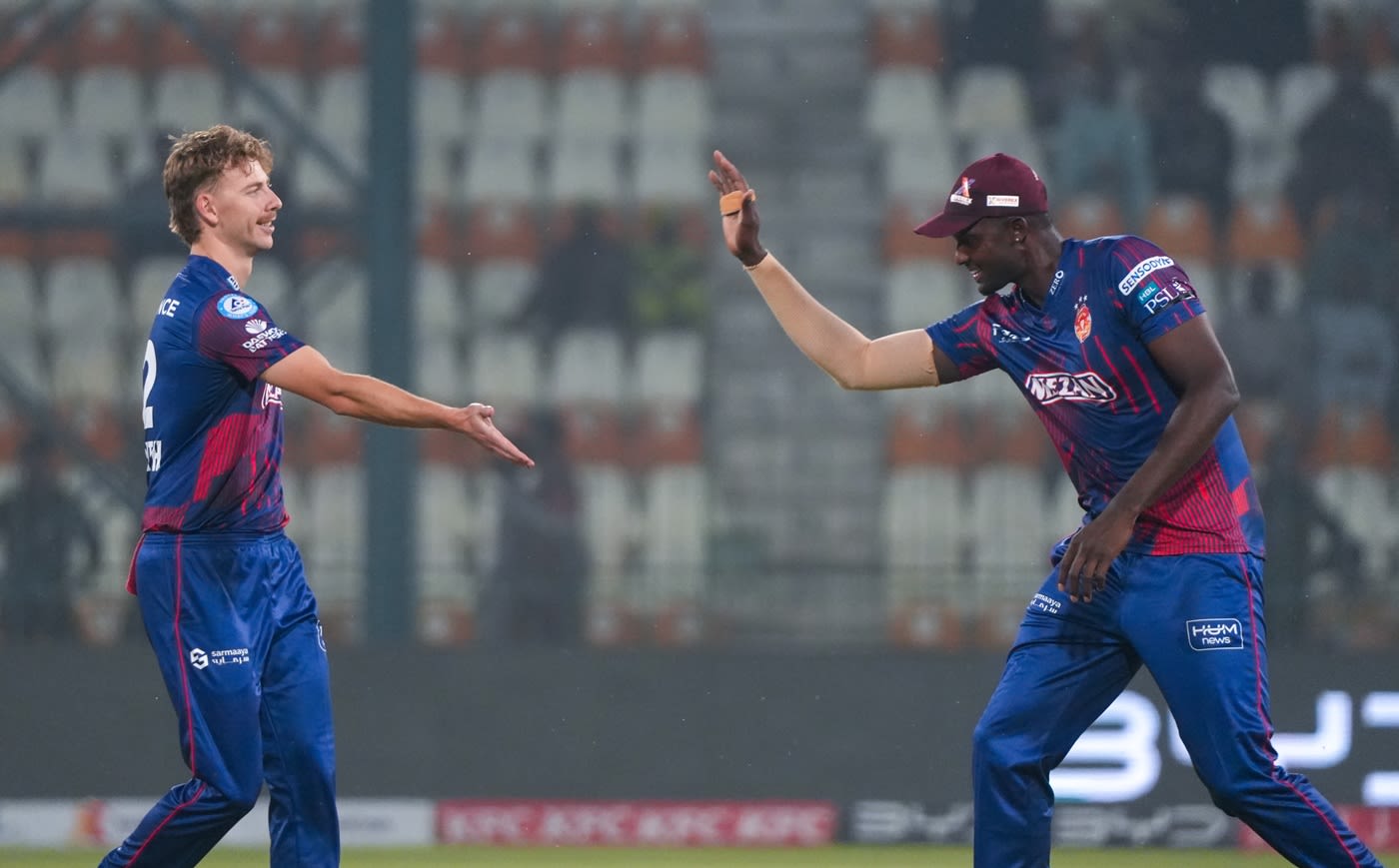 Riley Meredith celebrates a wicket with Jason Holder