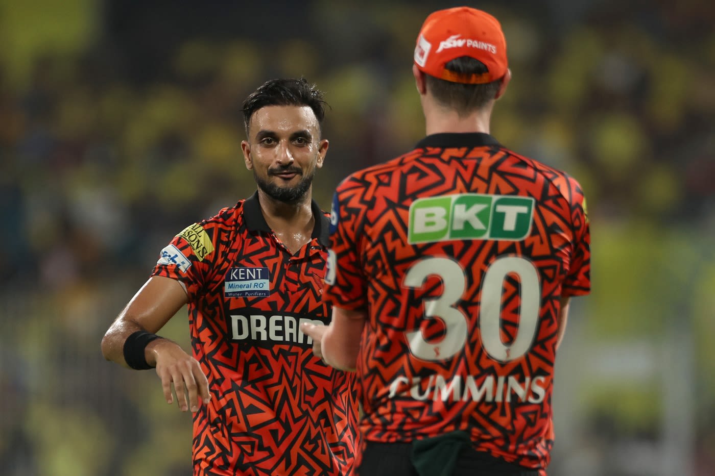 Harshal Patel celebrates a wicket with Pat Cummins