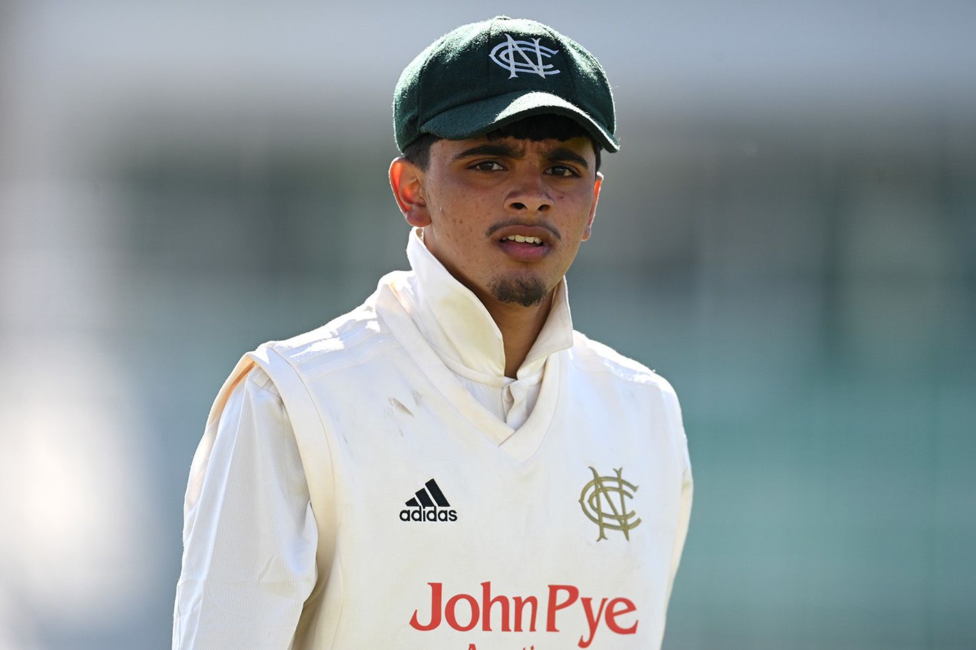 Farhan Ahmed looks on from the field