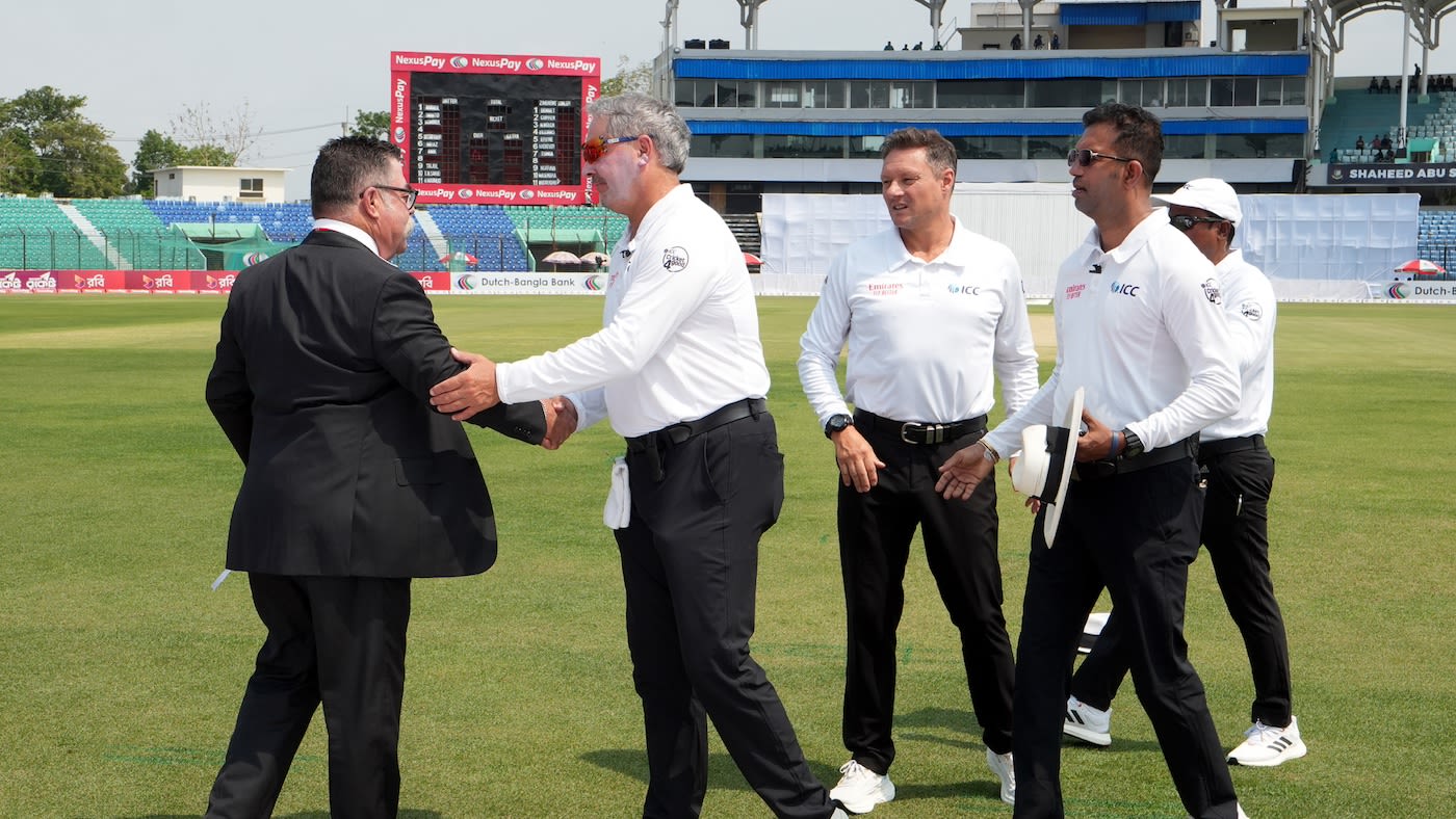 Match officials Richard Illingworth, Richard Kettleborough and Kumar Dharmasena greet David Boon