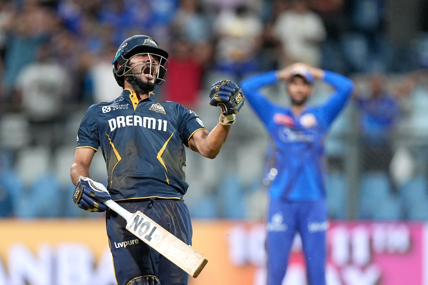 Arshad Khan celebrates after hitting the winning run