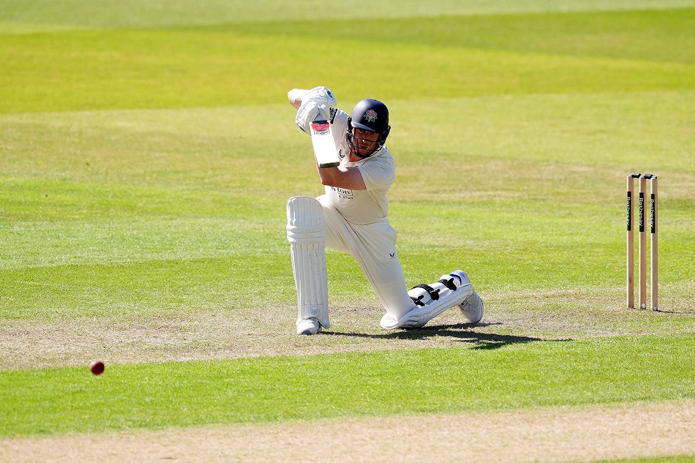 Luke Wells drives during his half-century