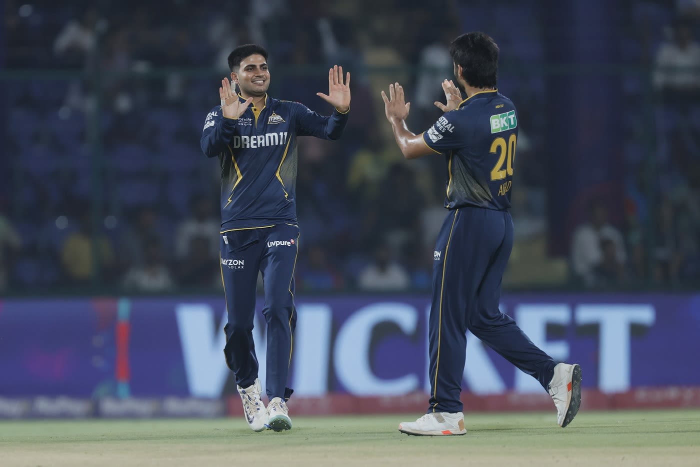Shubman Gill and Arshad Khan celebrate the wicket of Faf du Plessis