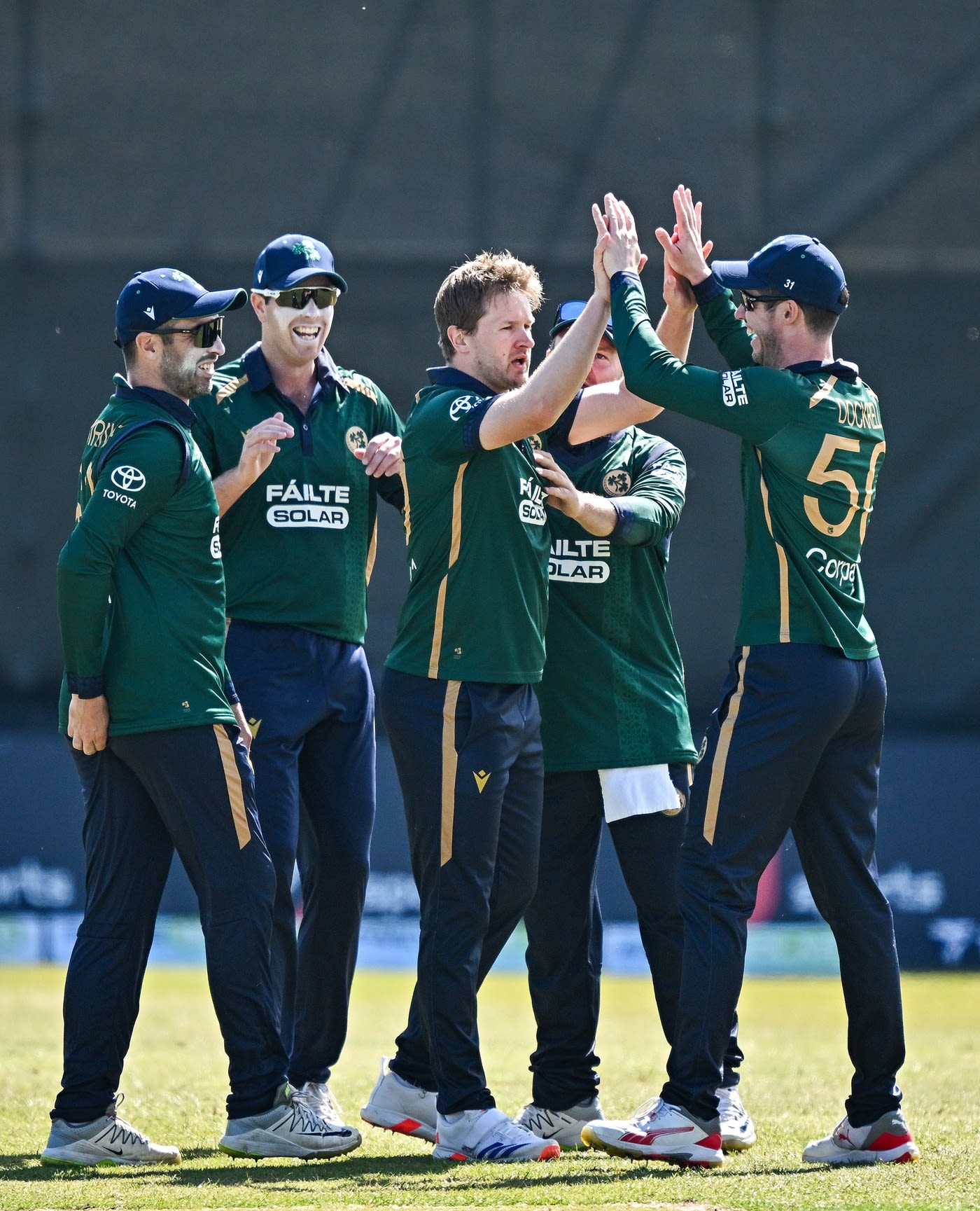 Barry McCarthy celebrates with his team-mates after dismissing Amir Jangoo