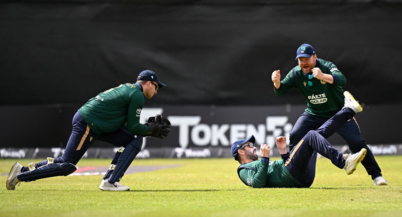 Paul Stirling celebrates Andrew Balbirnie's catch that dismissed Evin Lewis