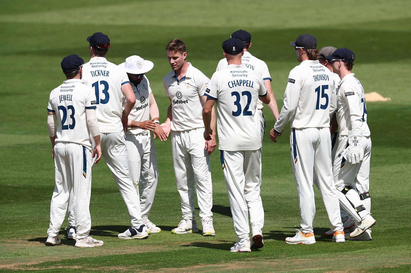 Luis Reece is congratulated on a wicket