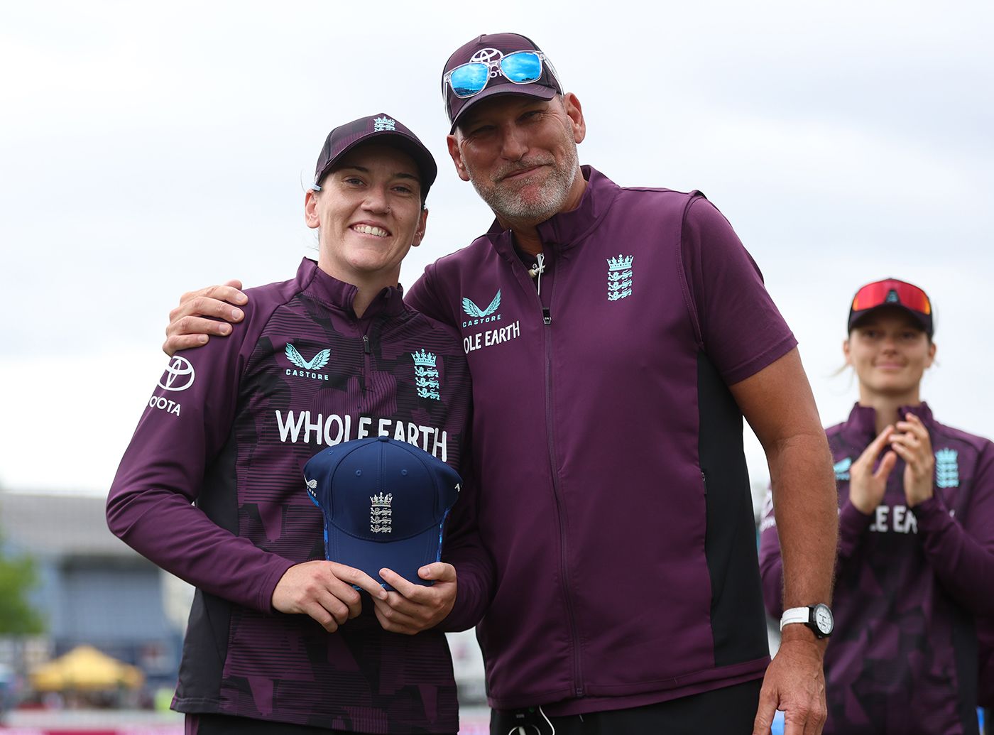 Em Arlott poses with her ODI cap alongside Matt Mason
