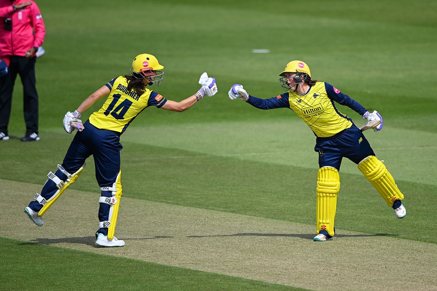 Maia Bouchier and Ella McCaughan punch gloves during their stand