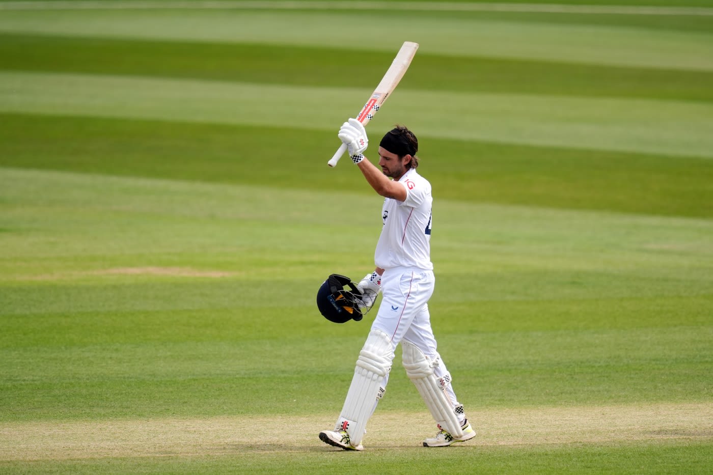 Max Holden celebrates his century