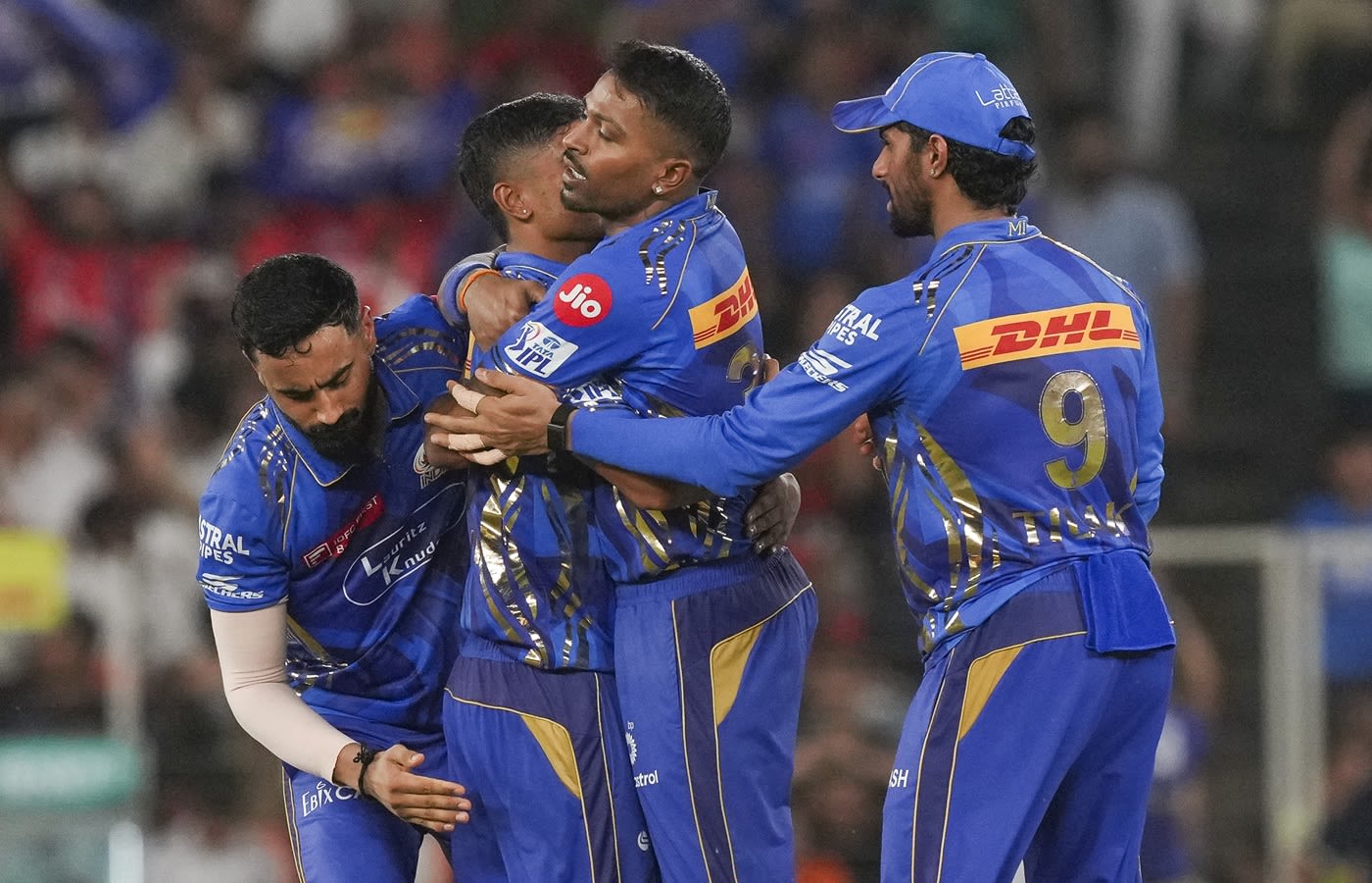Ashwani Kumar gets a hug from his captain Hardik Pandya