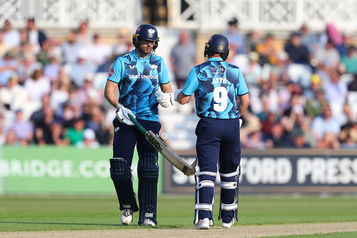 Dawid Malan (L) and Adam Lyth (R) bring up their 50 partnership
