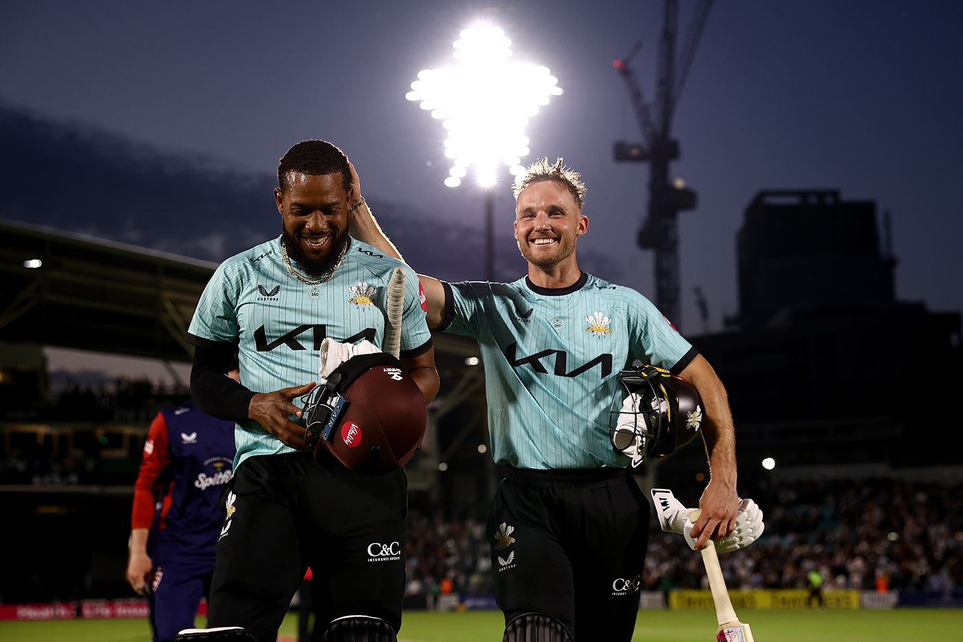 Chris Jordan and Laurie Evans walk off after sealing victory