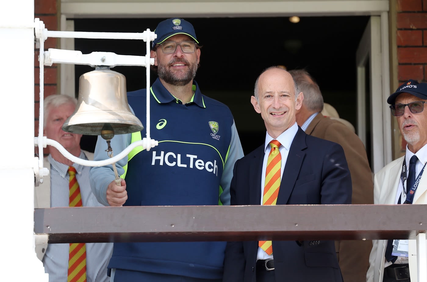 Australia's assistant coach Daniel Vettori rings the bell
