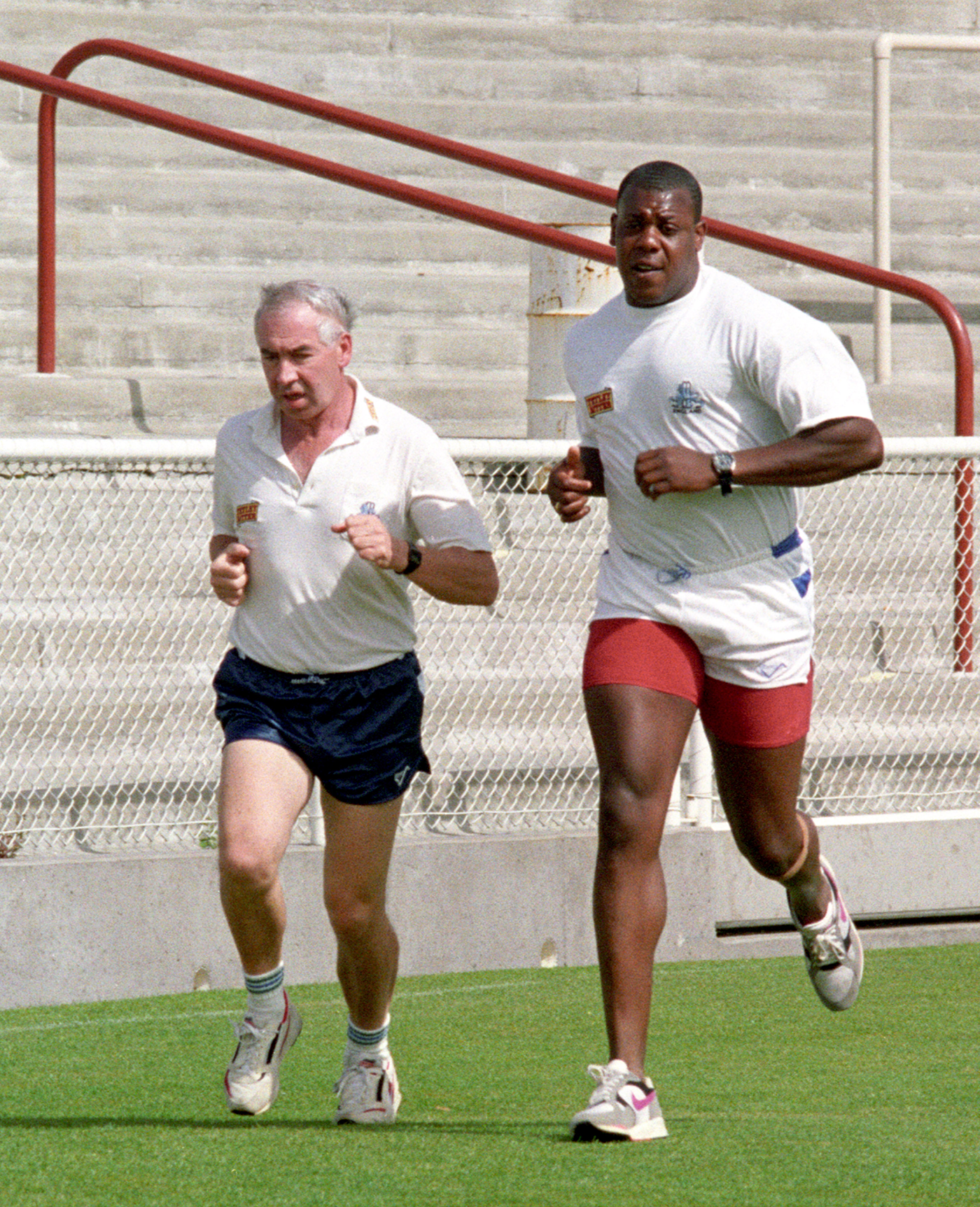 David Lawrence (right) and England physio Laurie Brown jog around the ground