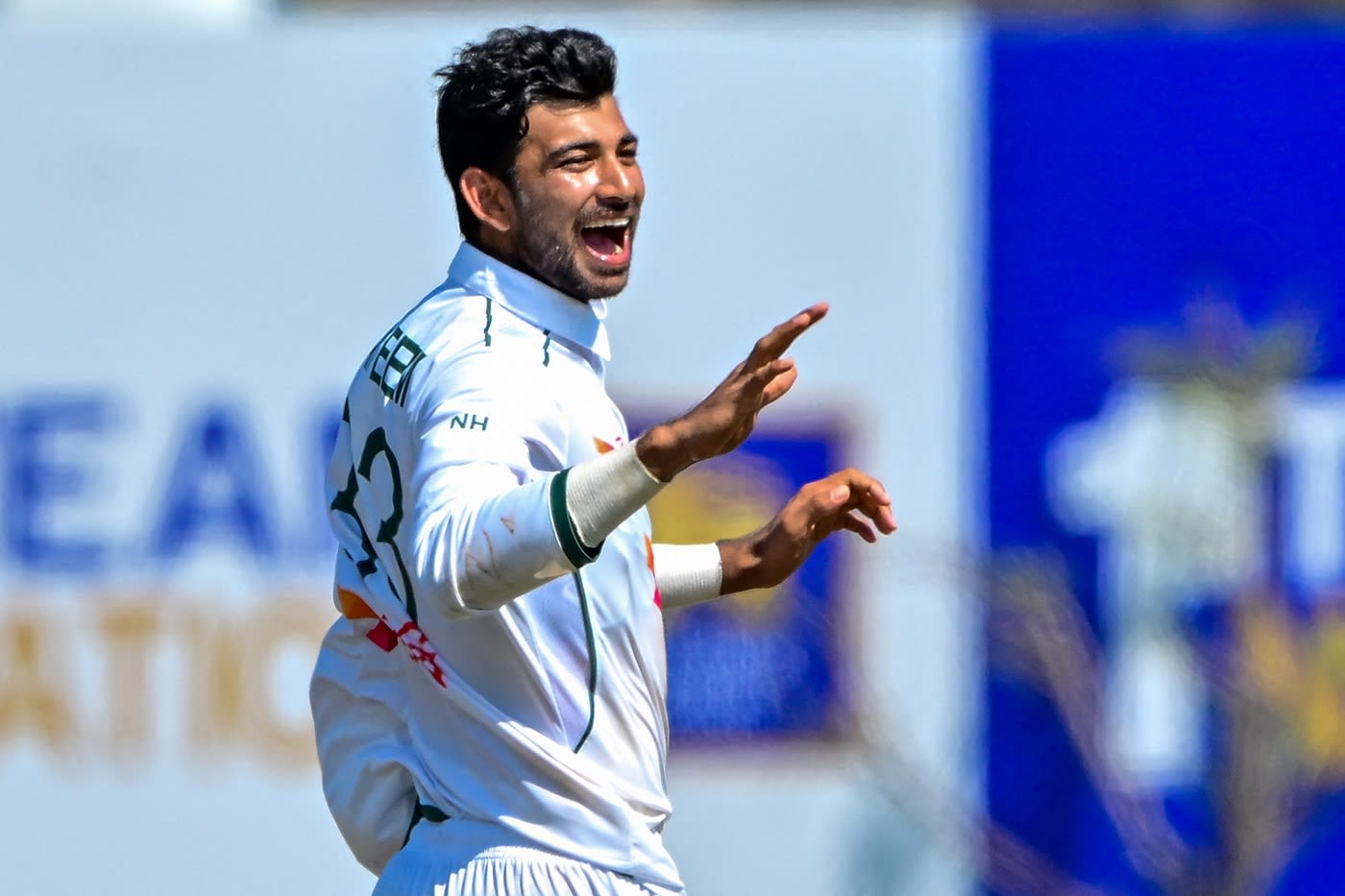 Nayeem Hasan celebrates getting the well-set Dinesh Chandimal