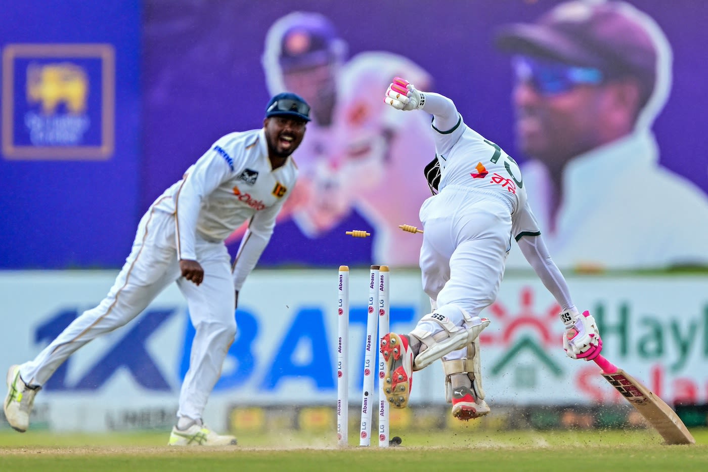 Tharindu Rathnayake hits the stumps to run Mushfiqur Rahim out