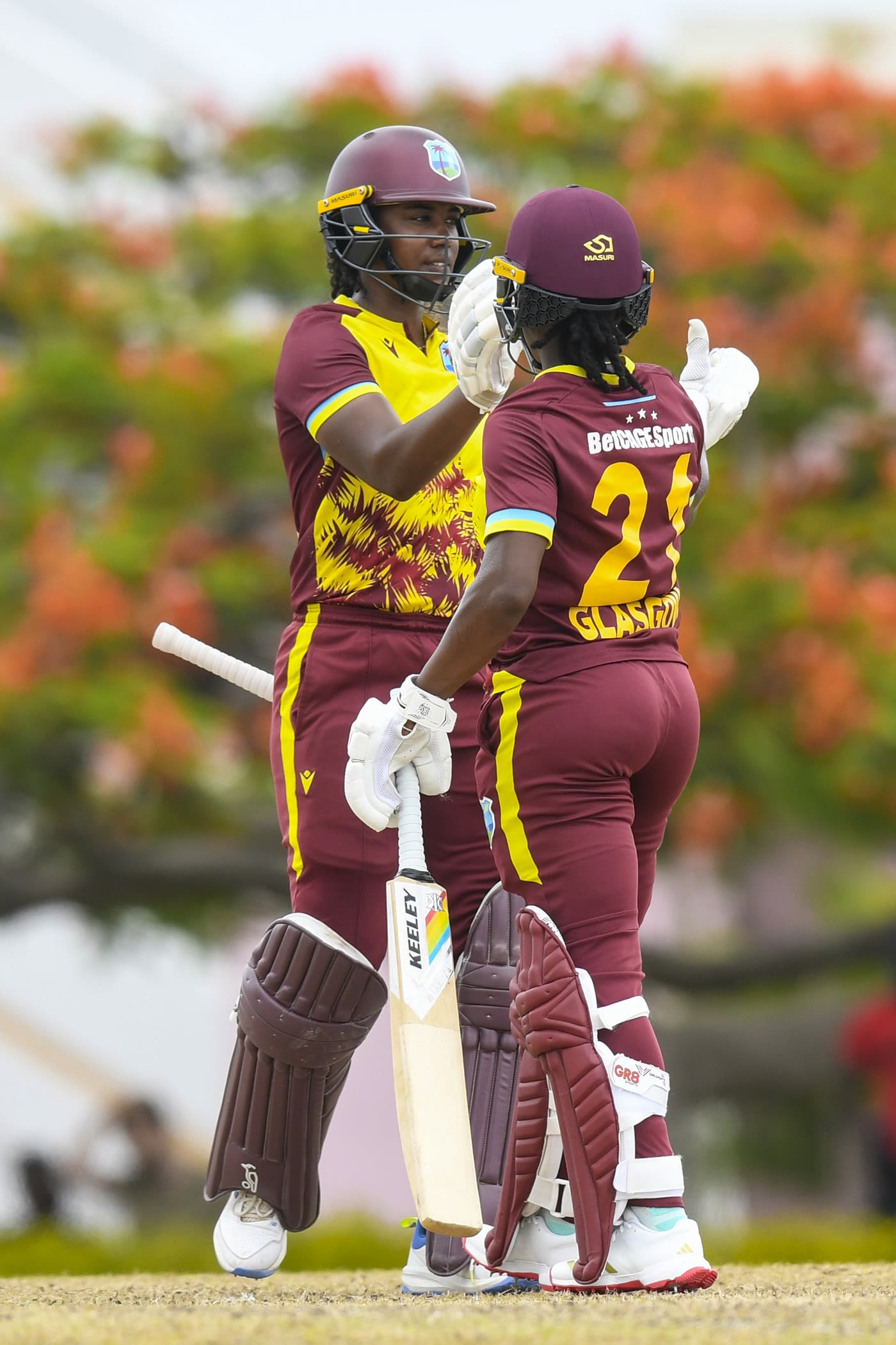 Jannillea Glasgow congratulates Hayley Matthews on her half-century