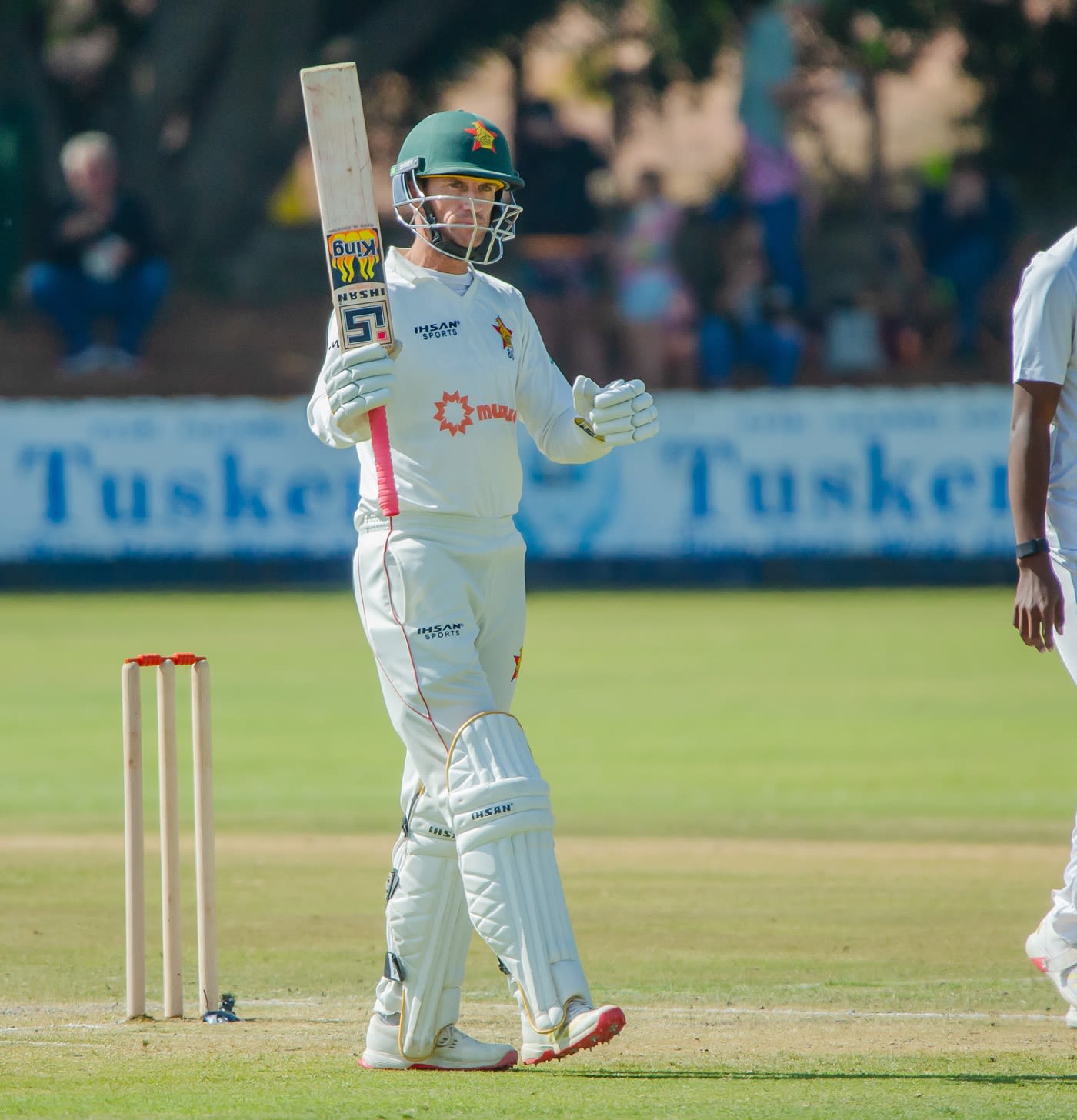 Sean Williams celebrates his fifty