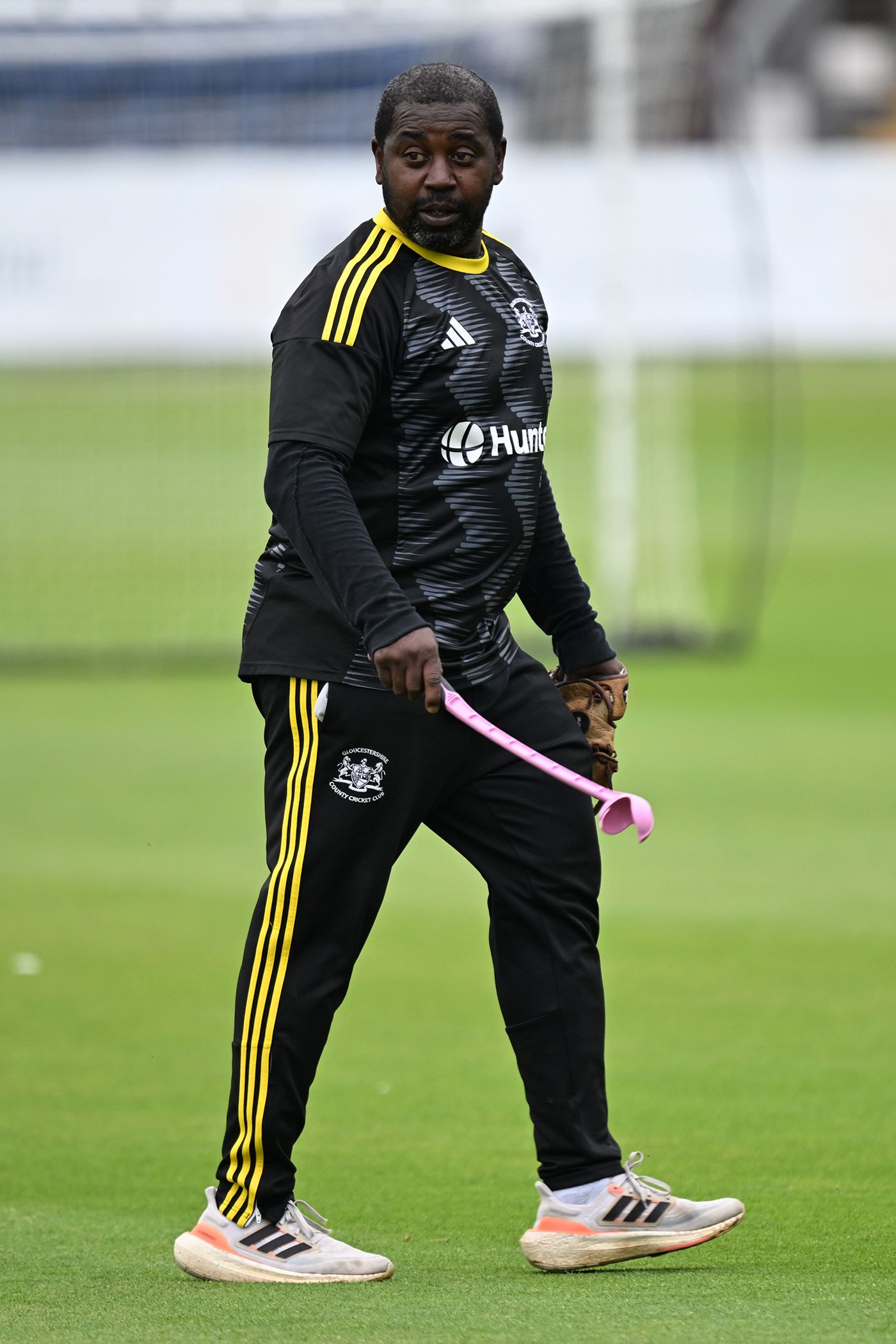 Mark Alleyne with his dog thrower before play