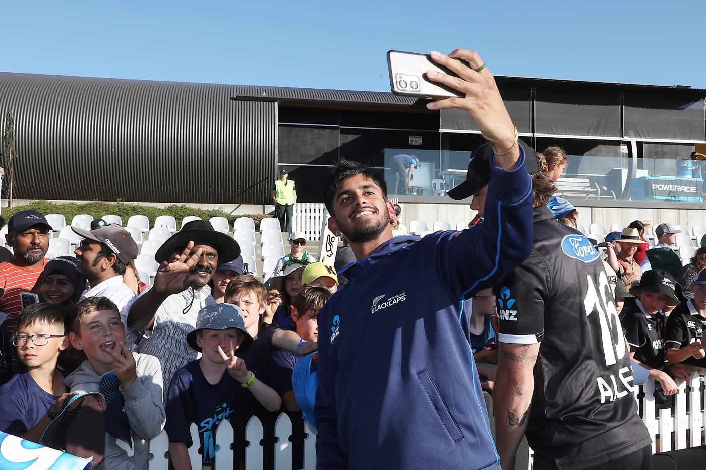 Adithya Ashok takes a selfie with fans