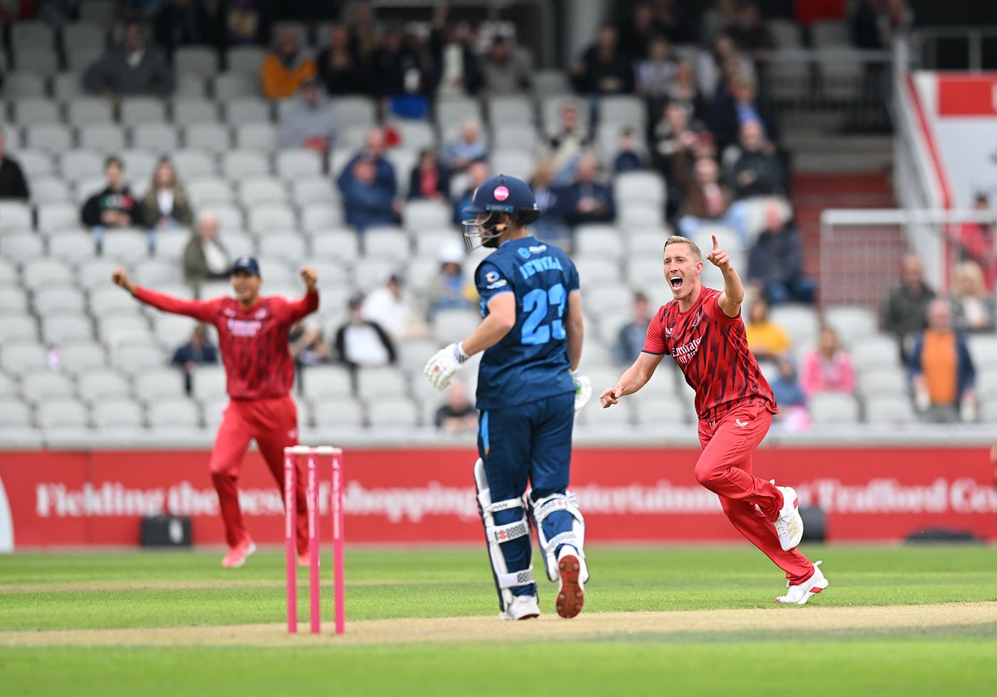 Luke Wood celebrates the wicket of Caleb Jewell with the first ball of the Derbyshire innings
