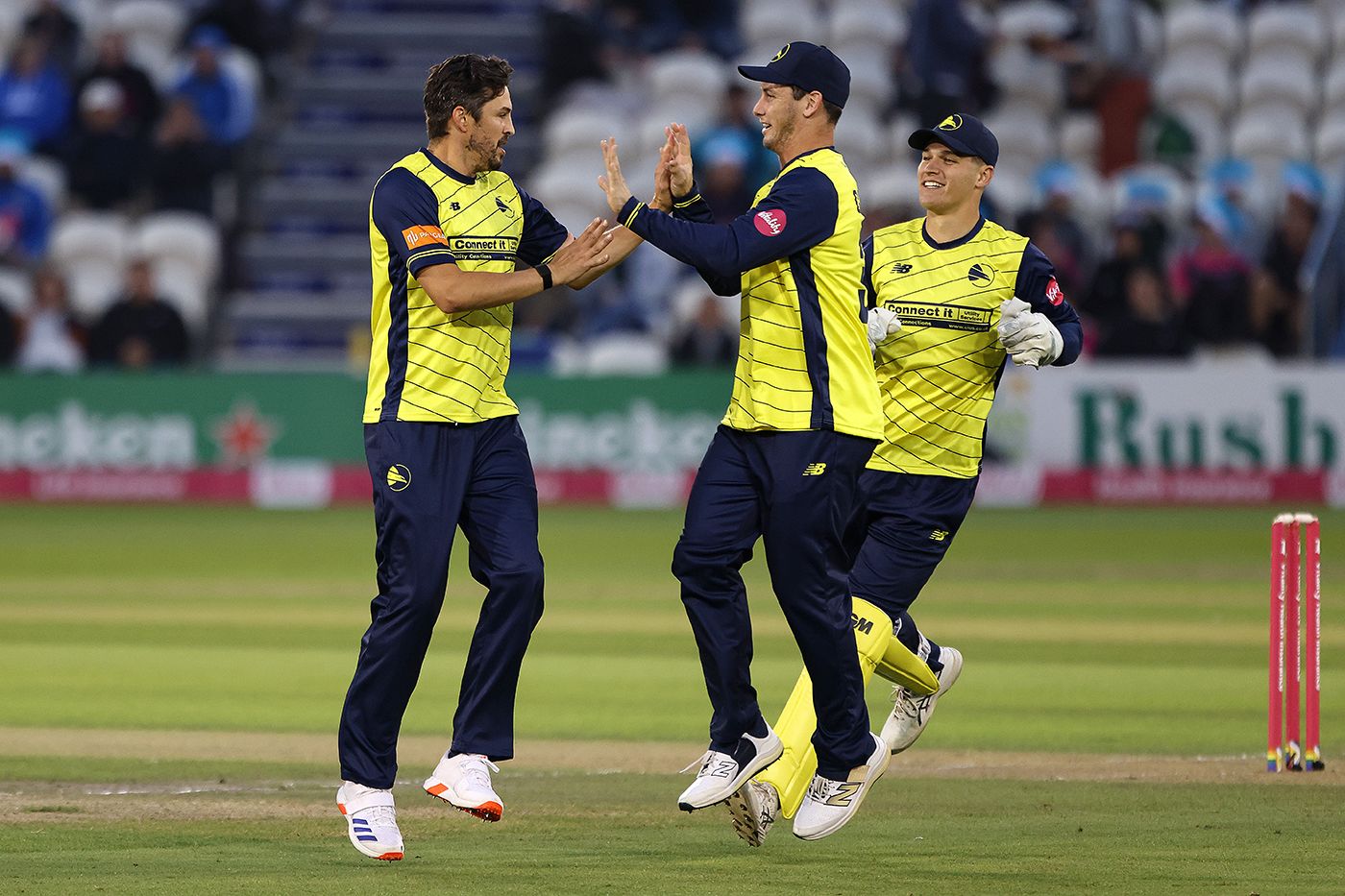 Chris Wood celebrates after taking the wicket of Harrison Ward