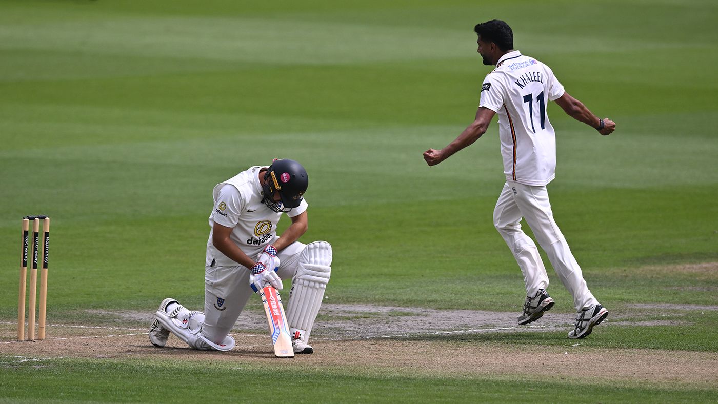 Khaleel Ahmed celebrates taking the wicket of Danial Ibrahim